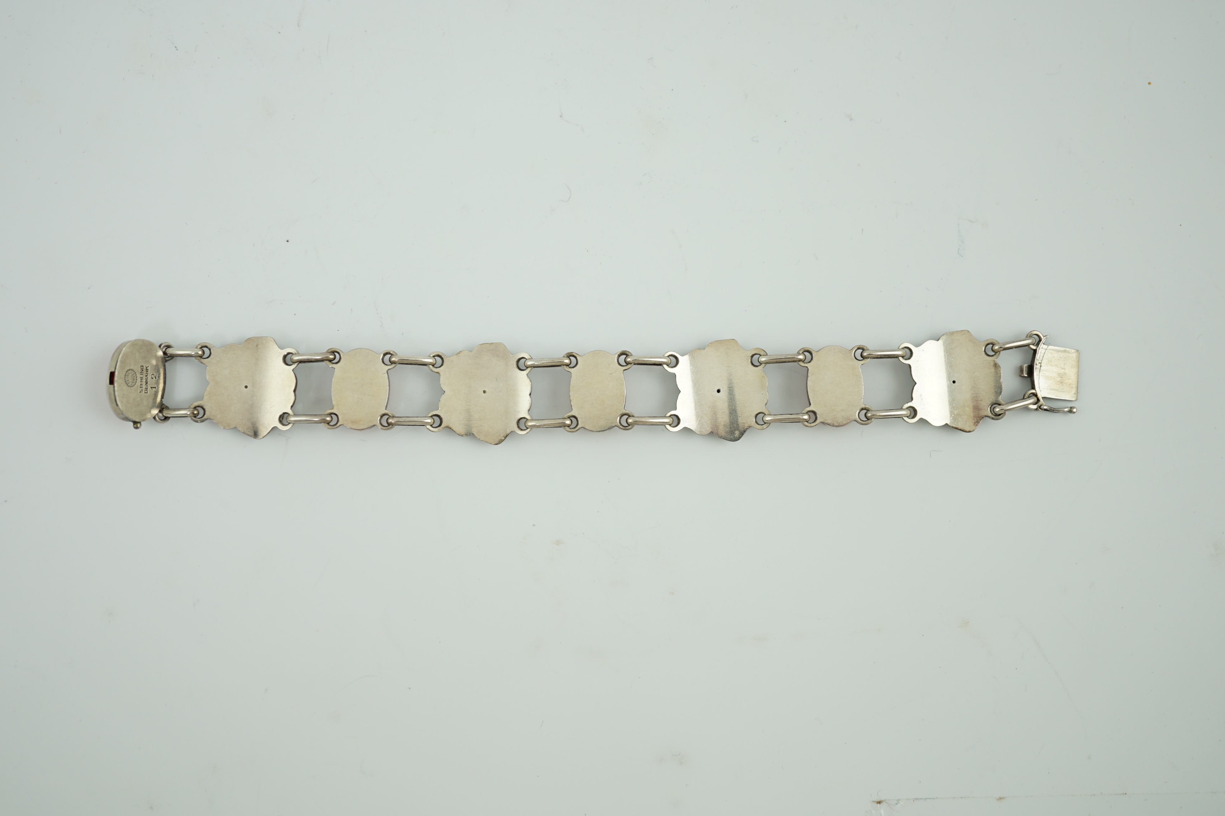 A George Jensen sterling silver and four stone cabochon coral set bracelet